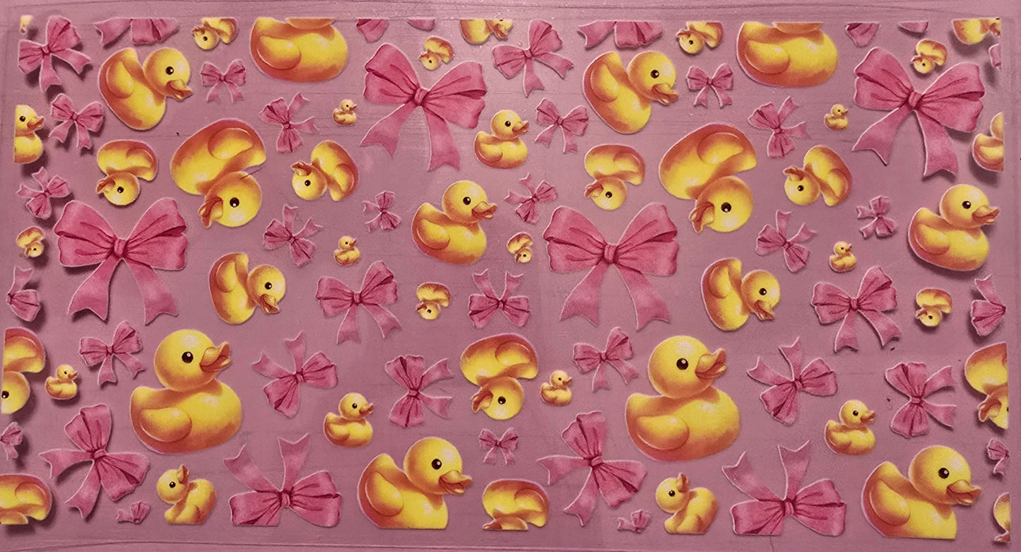 Rubber duck with pink bow wrap